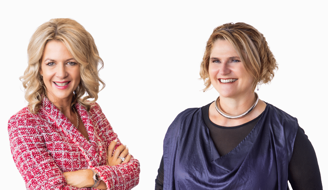 Two women with their arms crossed in front of a white background